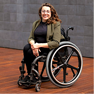 Allie Cannington smiling in wheelchair
