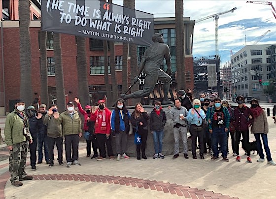 About 23 AASCEND members in front of the Willie Mays statue at Giants Stadium in San Francisco
